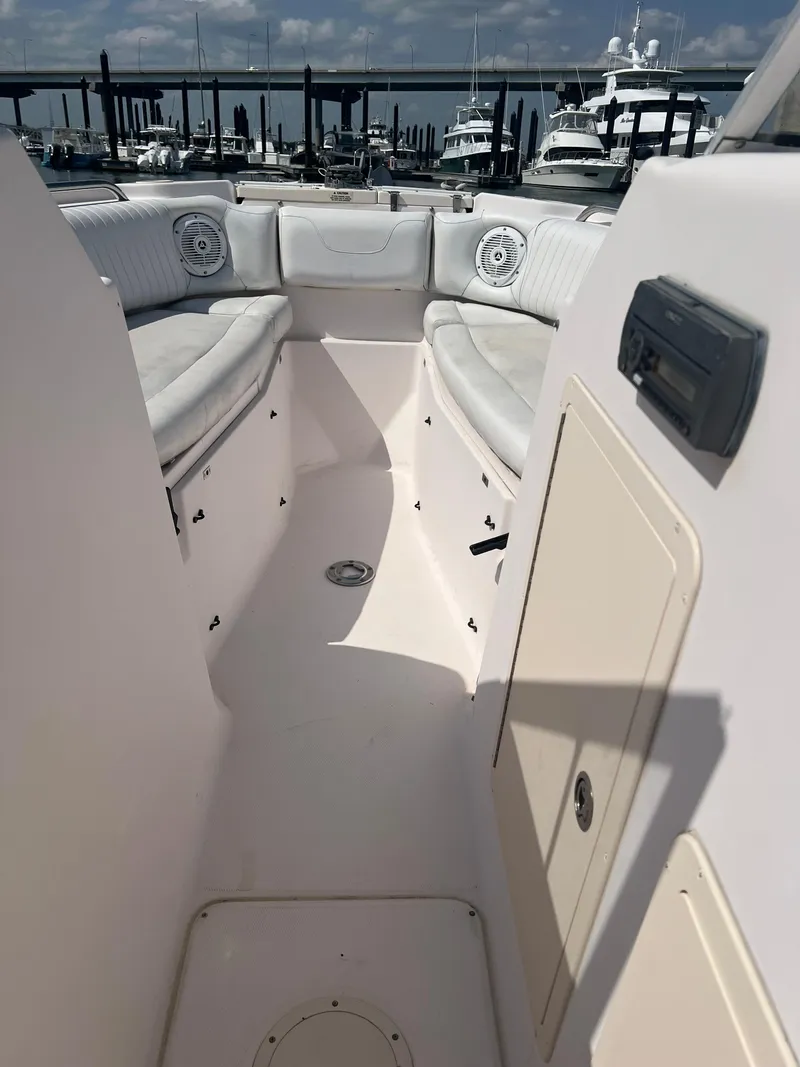 Slide: The Image of 2007 Grady-White Tournament 275 boat interior with seating, docked at marina. - 13