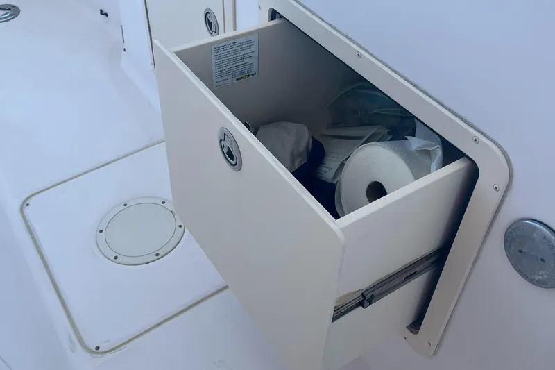 Slide: The Image of Storage compartment on 2007 Grady-White Tournament 275 boat with supplies. - 14