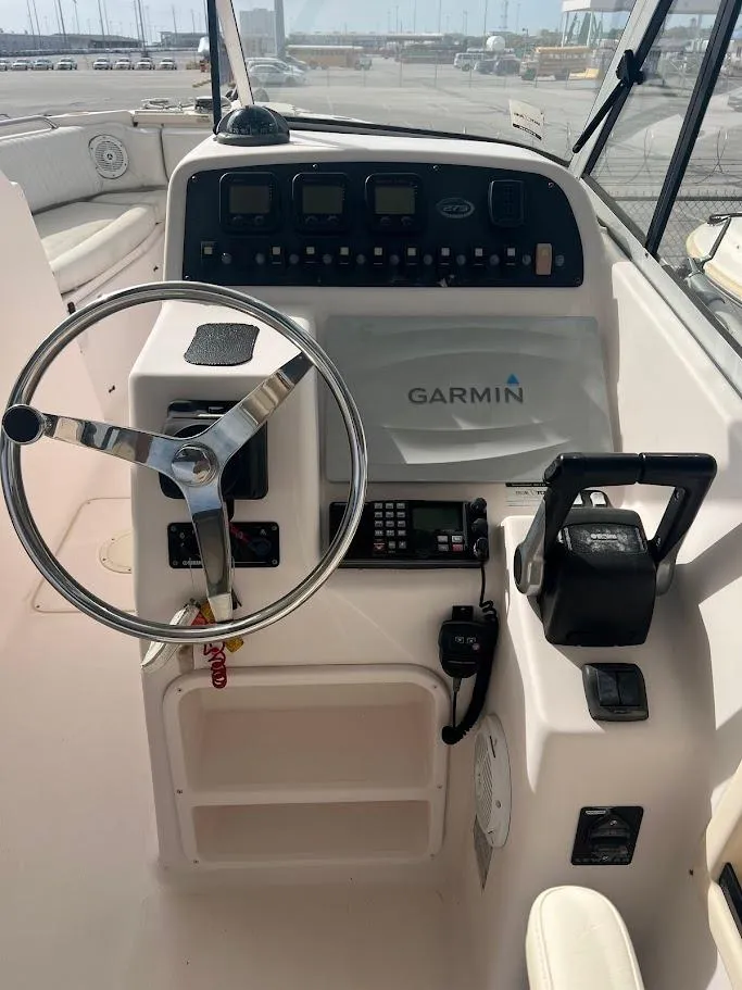 Slide: The Image of 2007 Grady-White Tournament 275 boat dashboard with Garmin navigation system. - 2