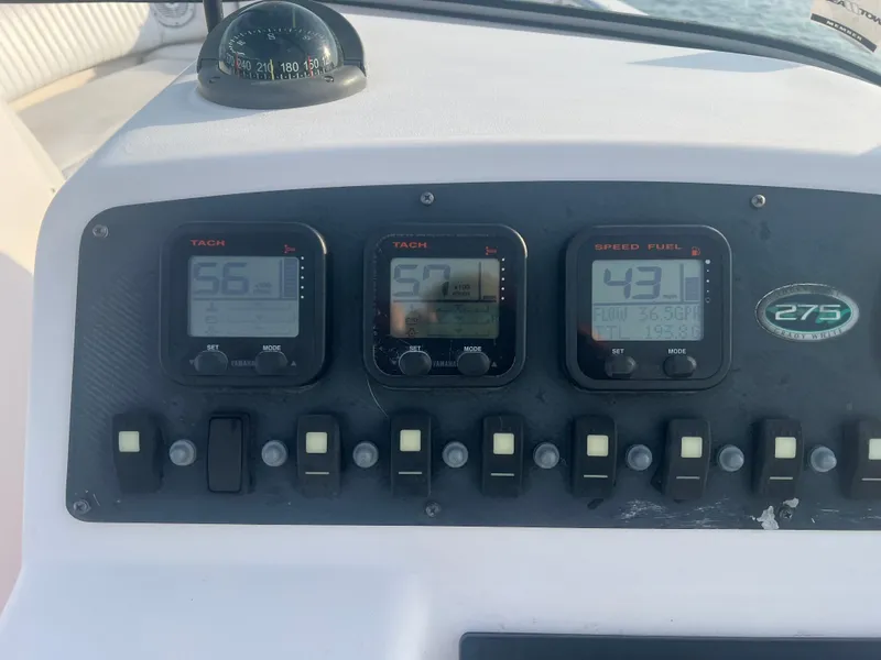 Slide: The Image of Dashboard of 2007 Grady-White Tournament 275 boat with gauges and controls. - 5