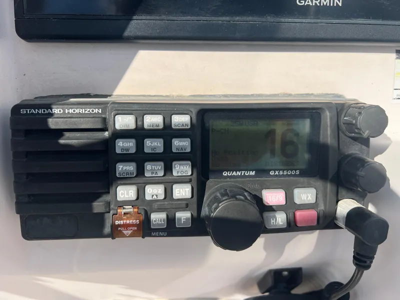 Slide: The Image of Standard Horizon marine radio on 2007 Grady-White Tournament 275 boat dashboard. - 7