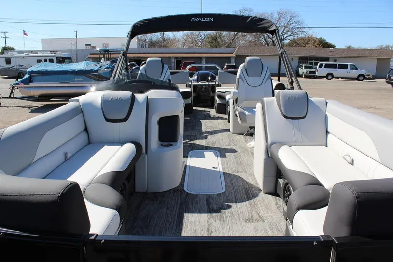 Slide: The Image of 2025 Avalon LSZ Quad Lounge Shift 25 FT pontoon boat with spacious seating and modern design. - 13