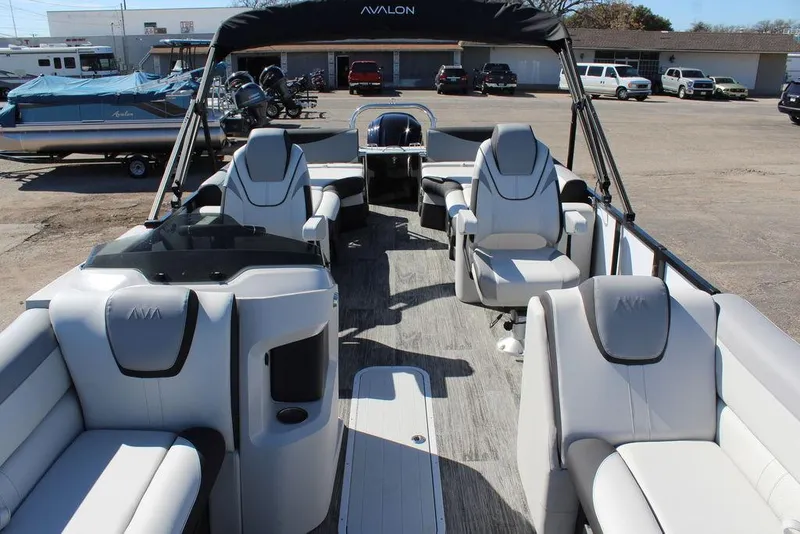 Slide: The Image of 2025 Avalon LSZ Quad Lounge Shift 25 FT pontoon boat interior with luxurious seating. - 14