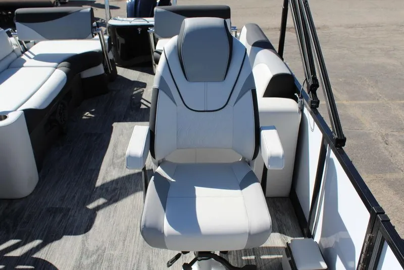 Slide: The Image of 2025 Avalon LSZ Quad Lounge boat interior with modern seating and sleek design. - 17