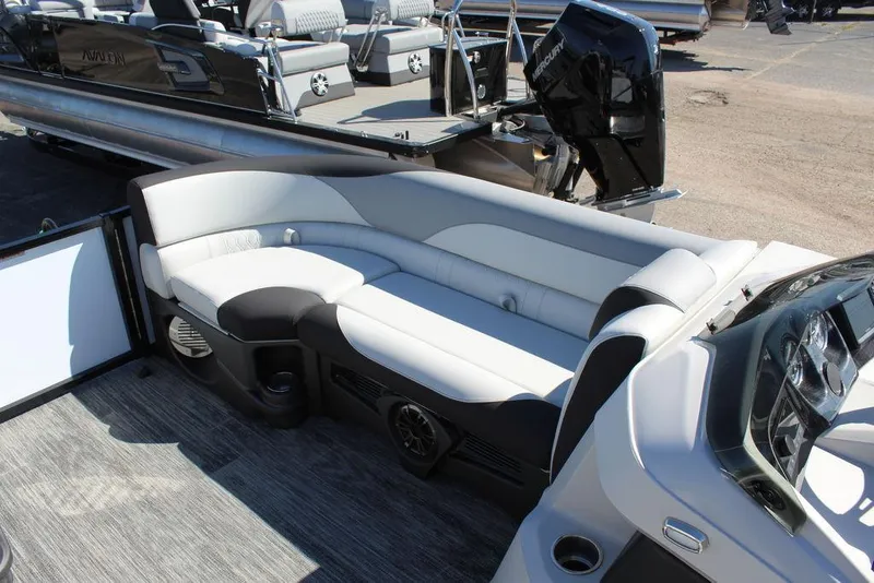 Slide: The Image of 2025 Avalon LSZ Quad Lounge Shift 25 FT pontoon boat interior with plush seating. - 25