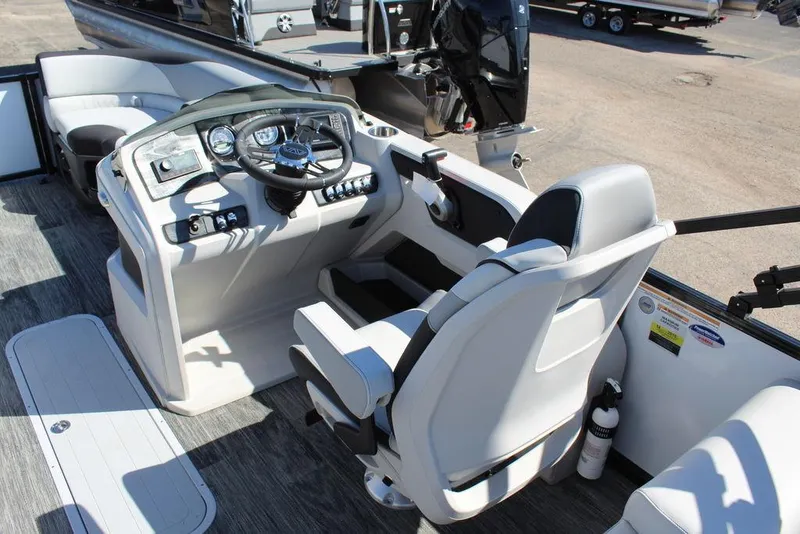 Slide: The Image of 2025 Avalon LSZ Quad Lounge Shift 25 FT boat interior with modern helm and seating. - 26