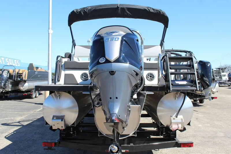 Slide: The Image of 2025 Avalon LSZ Quad Lounge Shift 25 FT pontoon boat with powerful outboard motor. - 5