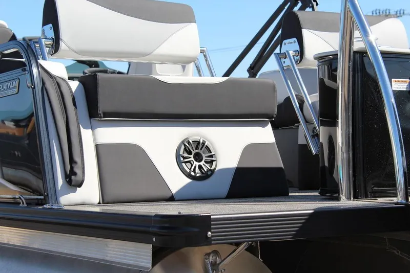 Slide: The Image of 2025 Avalon LSZ Quad Lounge Shift 25 FT boat interior with stylish seating and speaker. - 6