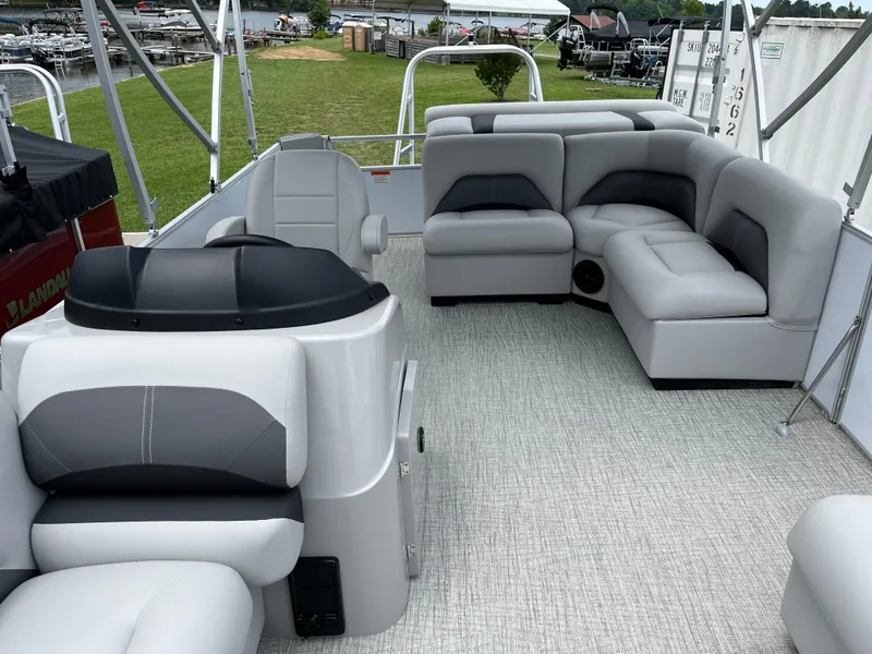Slide: The Image of 2024 Landau Island Breeze 232 Cruise pontoon boat with spacious seating and modern design. - 12