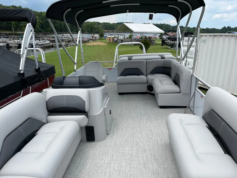 Slide: The Image of 2024 Landau Island Breeze 232 Cruise pontoon boat with spacious seating and canopy. - 14