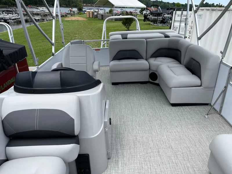 Slide: The Image of 2024 Landau Island Breeze 232 Cruise pontoon boat with spacious seating and modern design. - 6