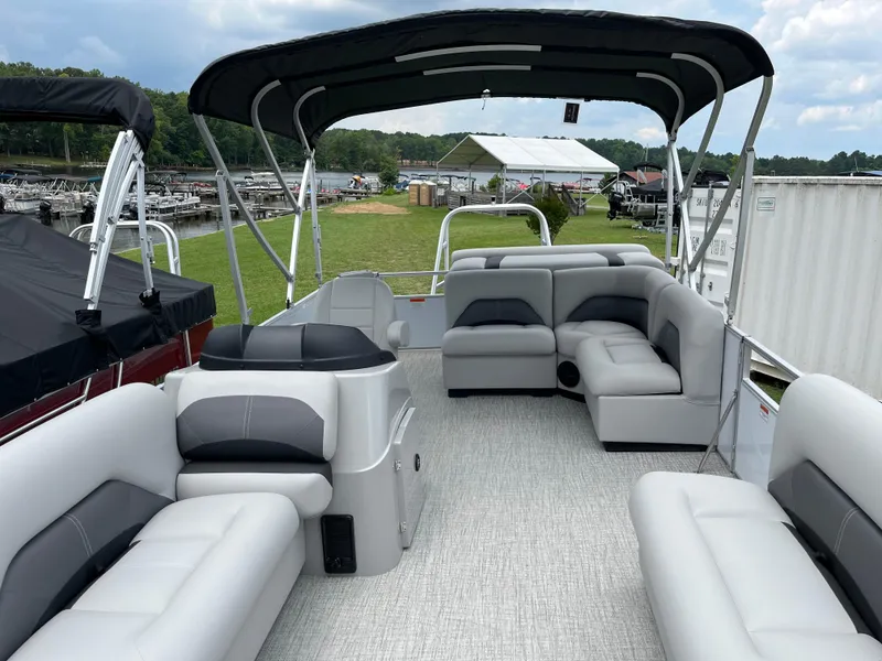 Slide: The Image of 2024 Landau Island Breeze 232 Cruise pontoon boat with spacious seating and canopy. - 8