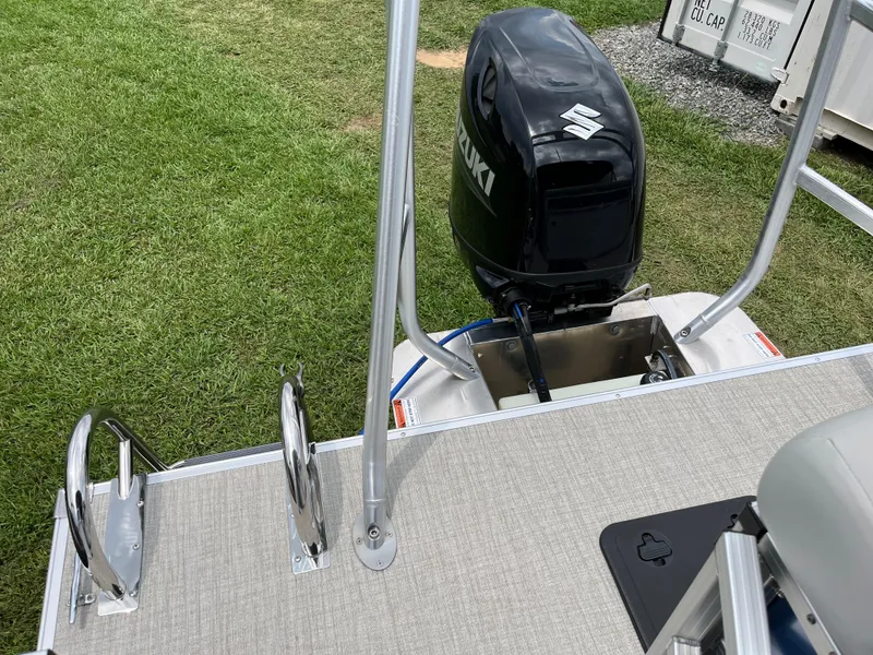 Slide: The Image of 2024 Landau Island Breeze 232 Cruise pontoon boat with Suzuki outboard motor. - 9
