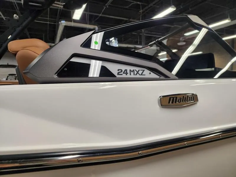 Slide: The Image of 2025 Malibu 24 MXZ boat interior with sleek design and modern features. - 23