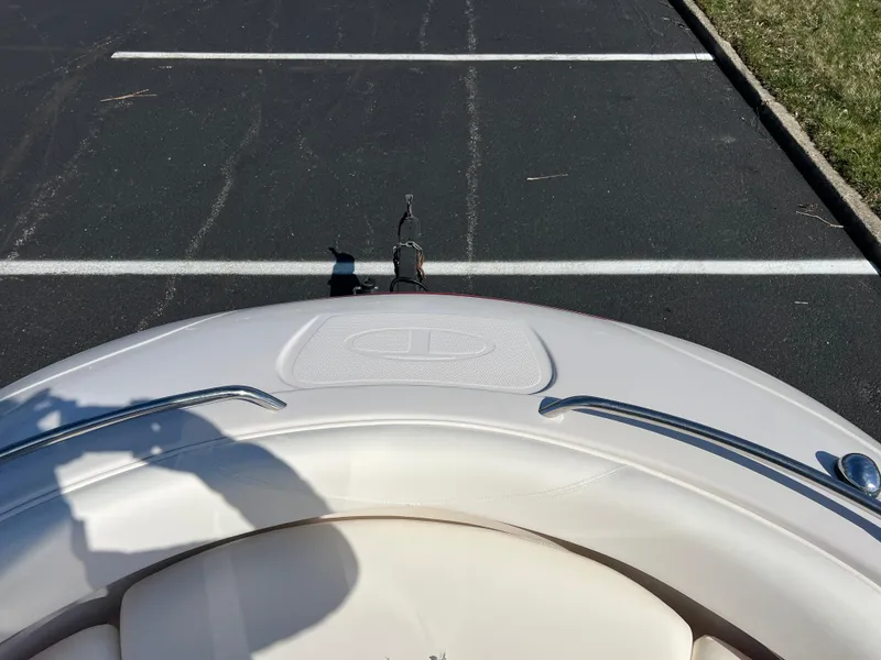 Slide: The Image of 2006 Tahoe 204 WT boat parked on asphalt, viewed from the bow. - 22