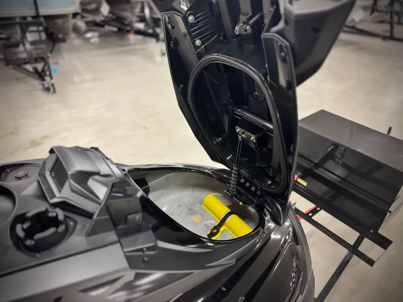 Slide: The Image of 2021 Yamaha WaveRunner FX Cruiser SVHO with open storage compartment in a showroom. - 12