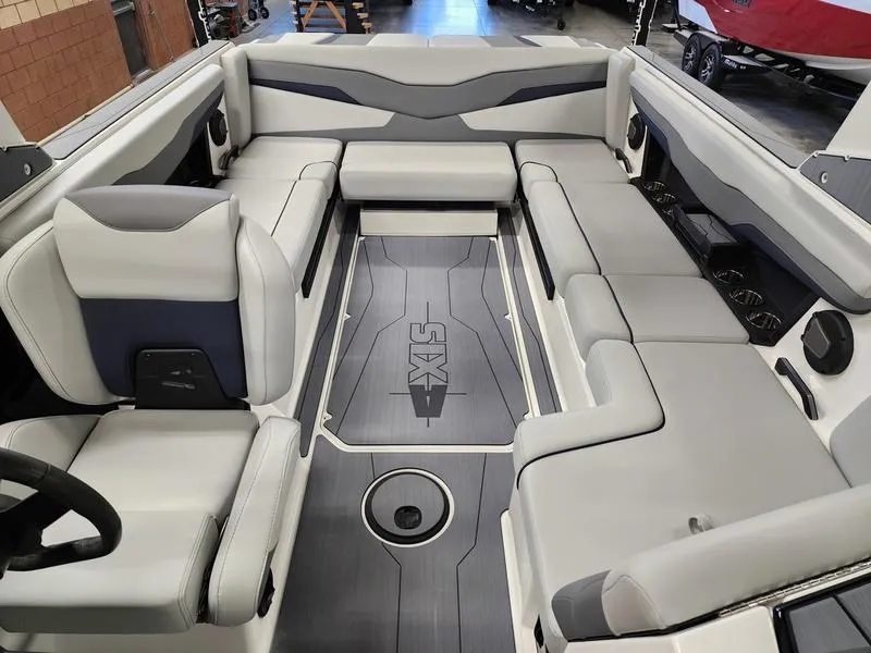 Slide: The Image of 2025 Axis T235 boat interior with spacious seating and sleek design. - 11