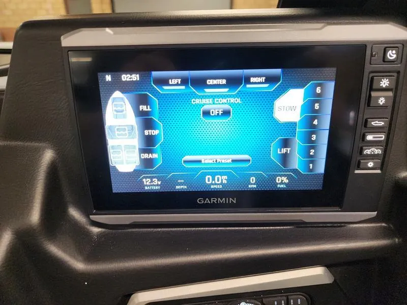 Slide: The Image of Garmin display in 2025 Axis T235 showing cruise control and system settings. - 15