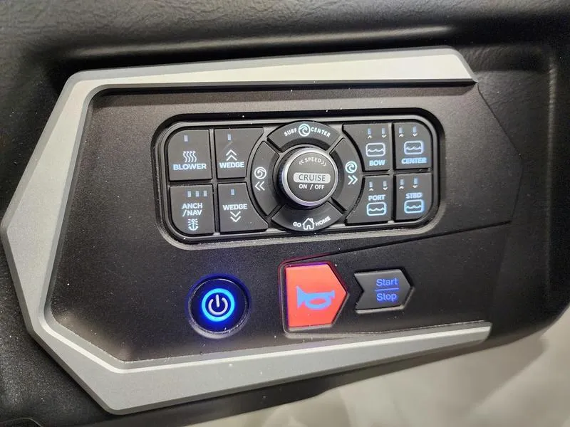 Slide: The Image of Dashboard controls of a 2025 Axis T235 boat, featuring various function buttons and indicators. - 17