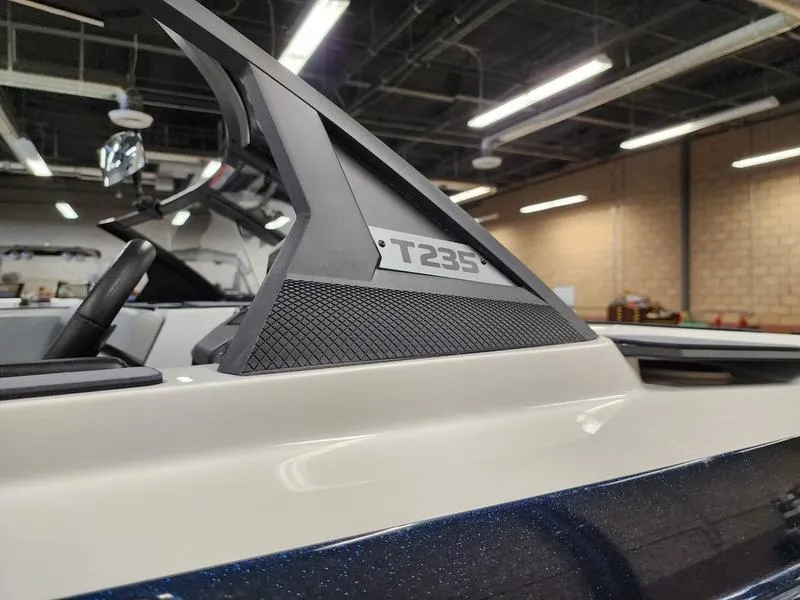 Slide: The Image of 2025 Axis T235 boat detail in showroom with modern design elements. - 21