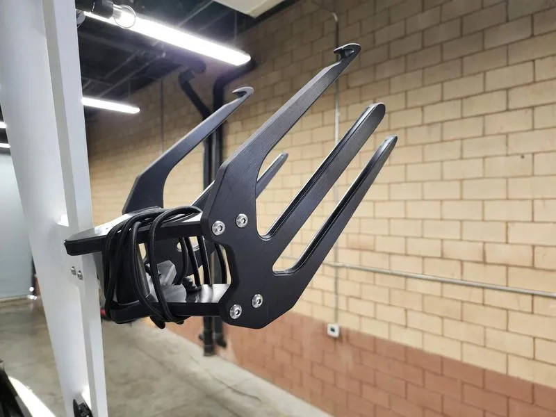 Slide: The Image of Wakeboard rack on 2025 Axis T235 boat, mounted in a garage. - 23