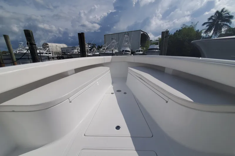 Slide: The Image of 2014 Bahama 41 FS boat interior with spacious seating and clear sky background. - 12
