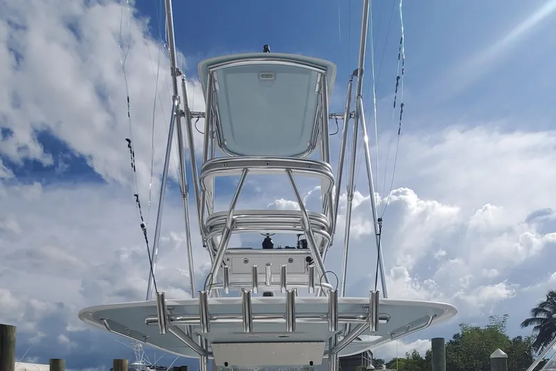 Slide: The Image of 2014 Bahama 41 FS boat with tower against a cloudy sky backdrop. - 17