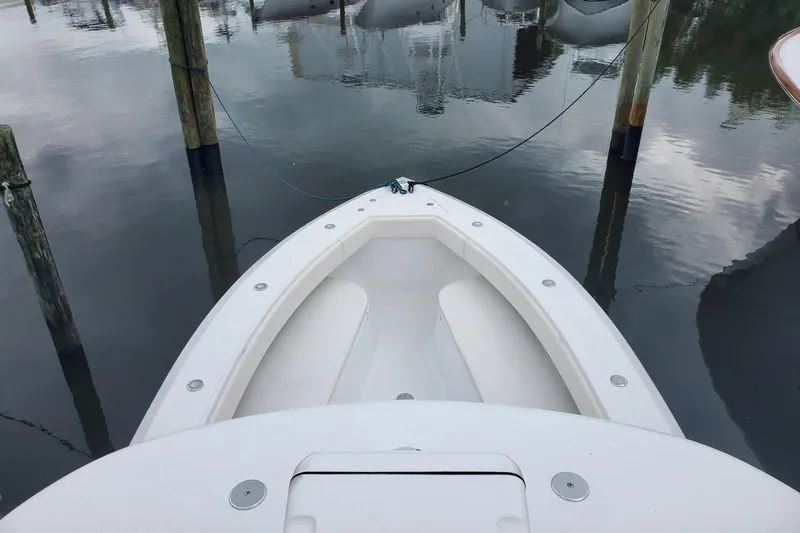 Slide: The Image of 2014 Bahama 41 FS boat docked in calm waters, viewed from above. - 18