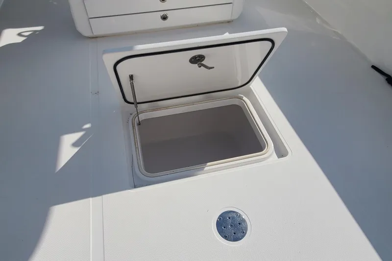 Slide: The Image of Open storage compartment on 2014 Bahama 41 FS boat deck. - 21