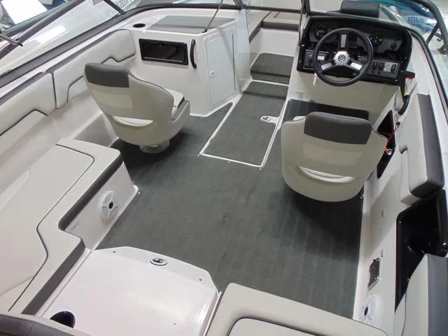 Slide: The Image of 2021 Yamaha Boats SX190 interior with seating and steering console. - 5