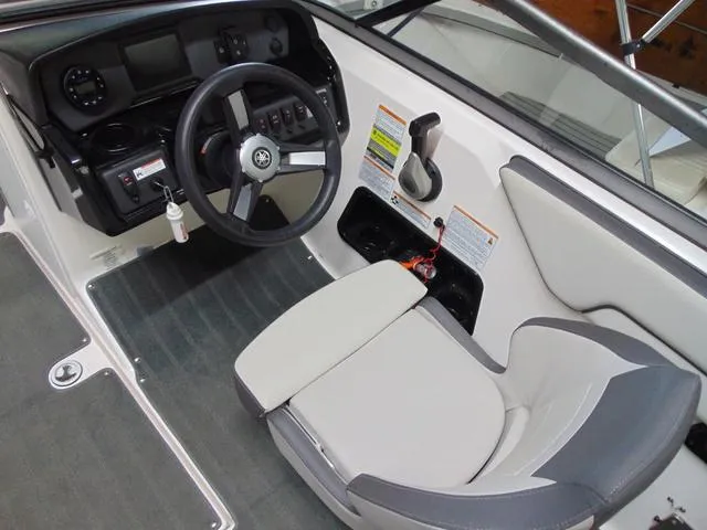 Slide: The Image of 2021 Yamaha Boats SX190 cockpit with steering wheel and control panel. - 6