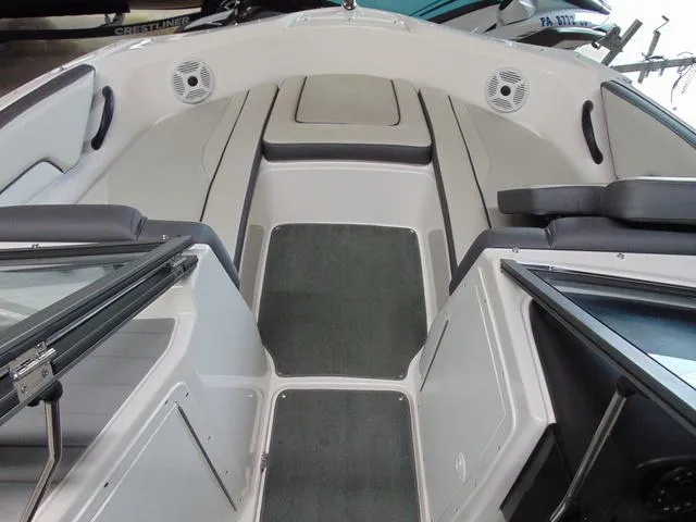Slide: The Image of 2021 Yamaha Boats SX190 interior with seating and speakers, showcasing modern design and comfort. - 8