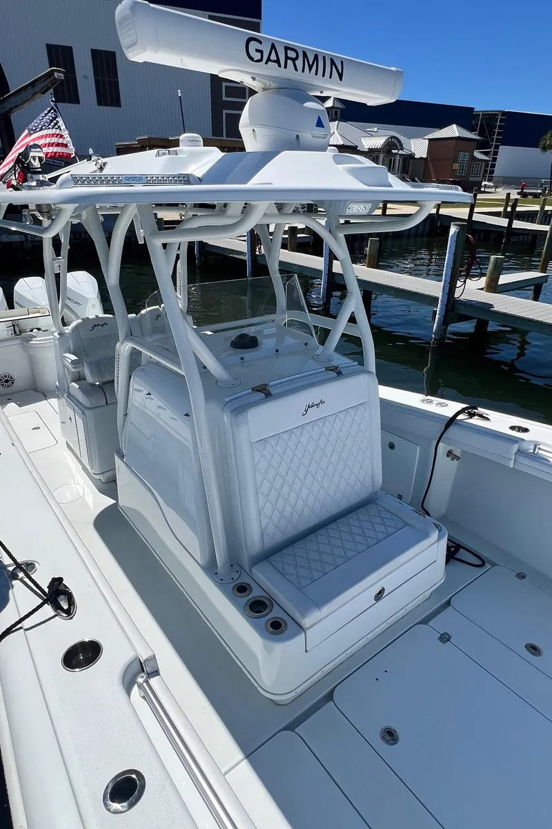 Slide: The Image of 2021 Yellowfin 36 Offshore boat with Garmin radar, docked at a marina. - 15