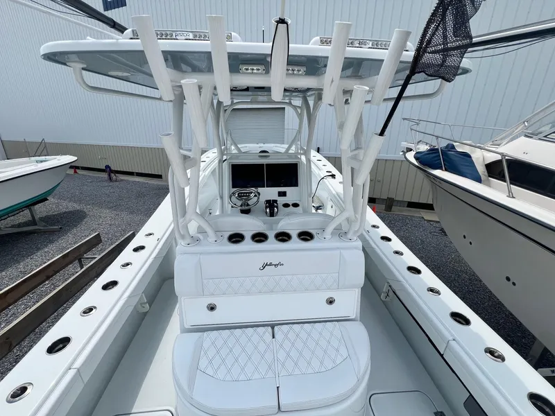 Slide: The Image of 2021 Yellowfin 36 Offshore boat with sleek white interior and advanced navigation equipment. - 32