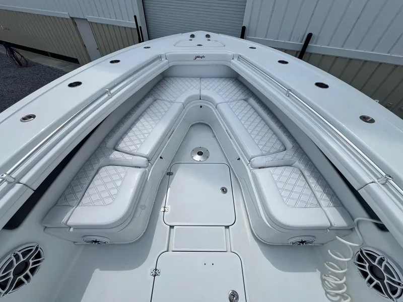 Slide: The Image of 2021 Yellowfin 36 Offshore boat with spacious white seating and modern design. - 34