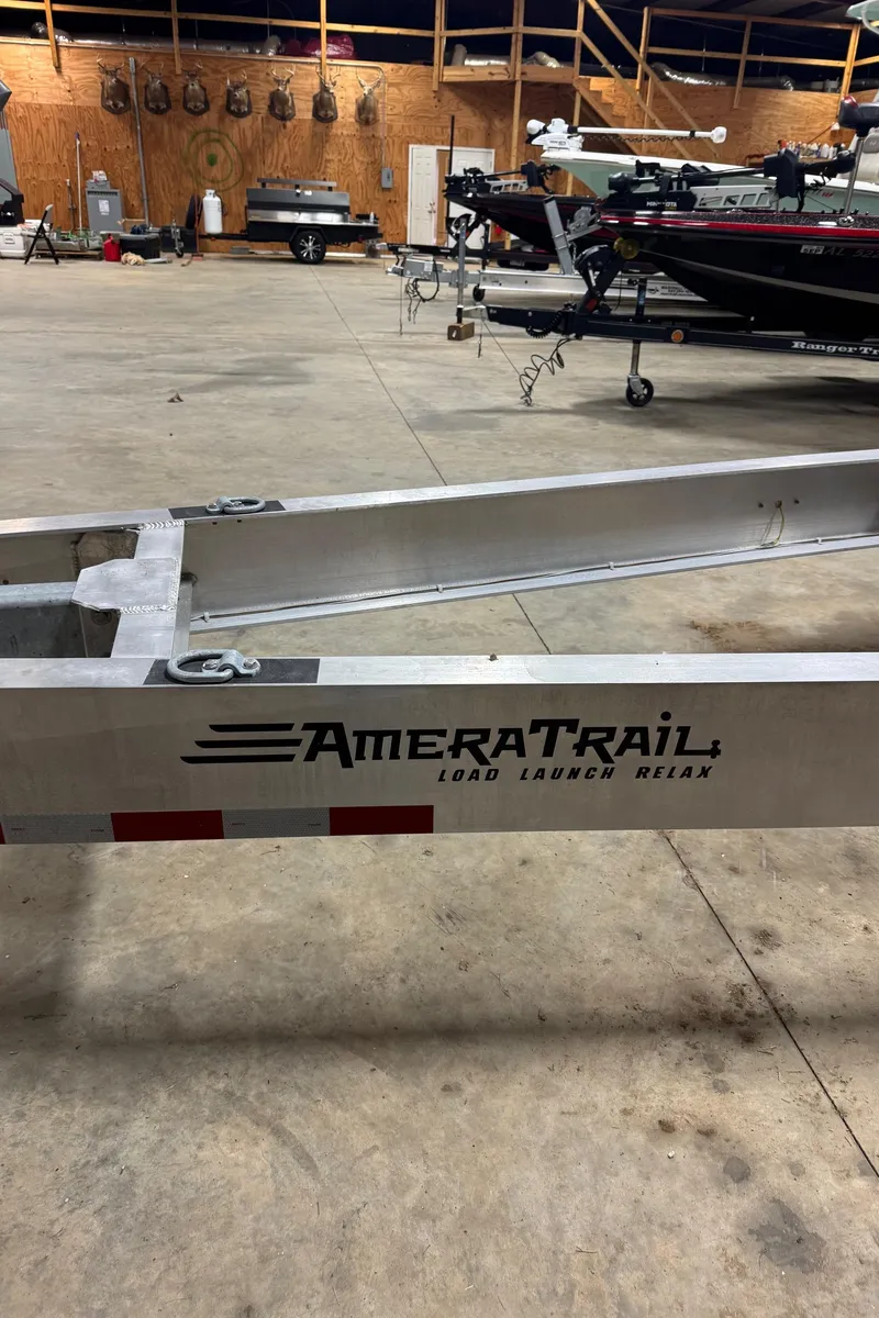 Slide: The Image of Trailer for 2021 Yellowfin 36 Offshore boat in a storage facility. - 38