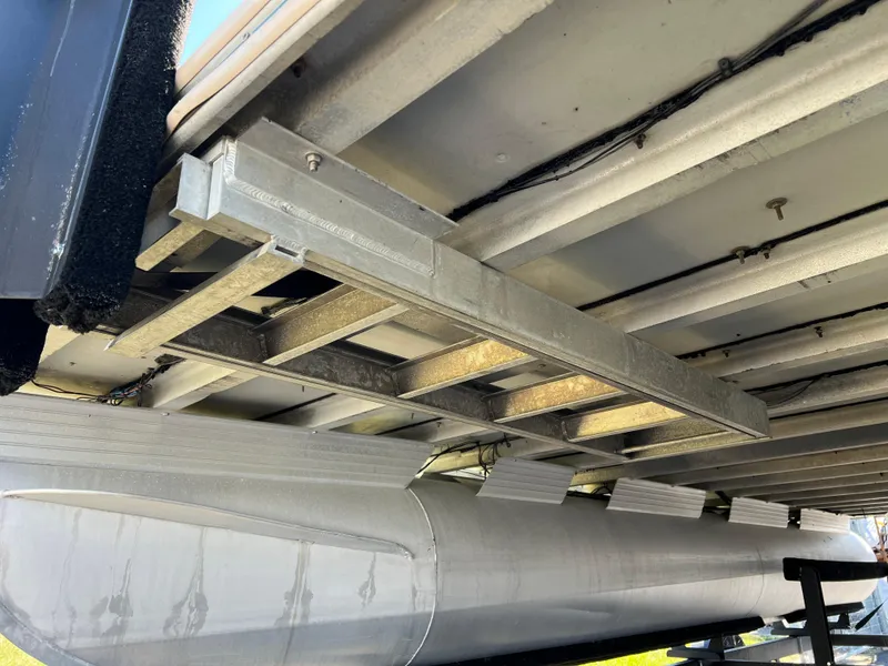 Slide: The Image of Underside view of a 1998 Fisher Freedom 200 DLX pontoon boat. - 24