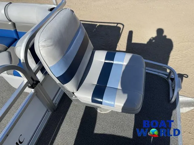 Slide: The Image of 2011 TMC 2200 SE Pontoon boat seat with blue and gray stripes, Boat World logo visible. - 14