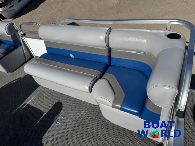 Slide: The Image of Gray and blue seating on 2011 TMC 2200 SE Pontoon boat, featuring cup holder. - 15