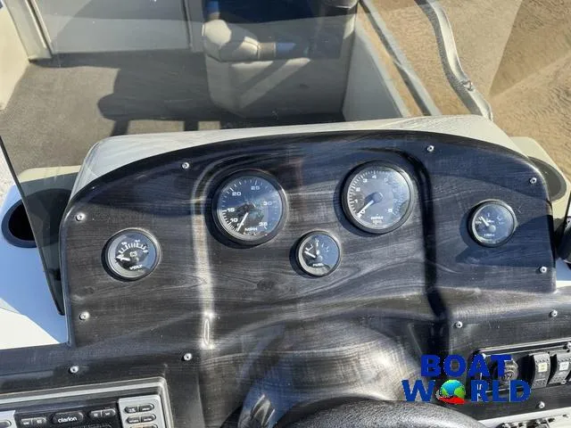 Slide: The Image of Dashboard of 2011 TMC 2200 SE Pontoon with gauges and controls. - 21