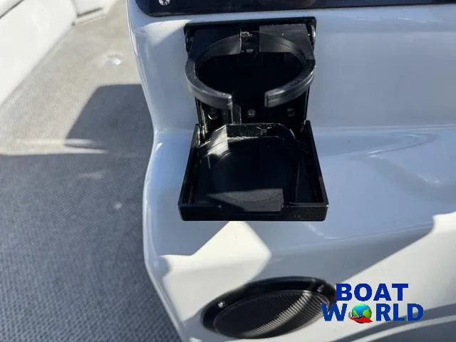 Slide: The Image of 2011 TMC 2200 SE Pontoon cup holder and speaker detail, Boat World logo visible. - 25