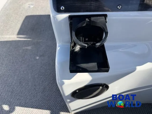 Slide: The Image of Cup holder and speaker on 2011 TMC 2200 SE Pontoon boat deck. - 26