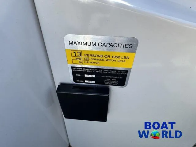 Slide: The Image of 2011 TMC 2200 SE Pontoon capacity label, 13 persons or 1950 lbs, Boat World logo. - 27