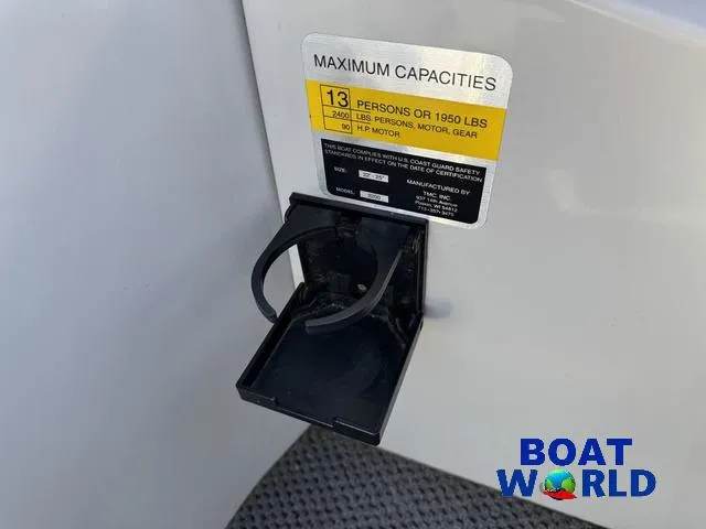 Slide: The Image of TMC 2200 SE Pontoon 2011 capacity label and cup holder, Boat World branding. - 28