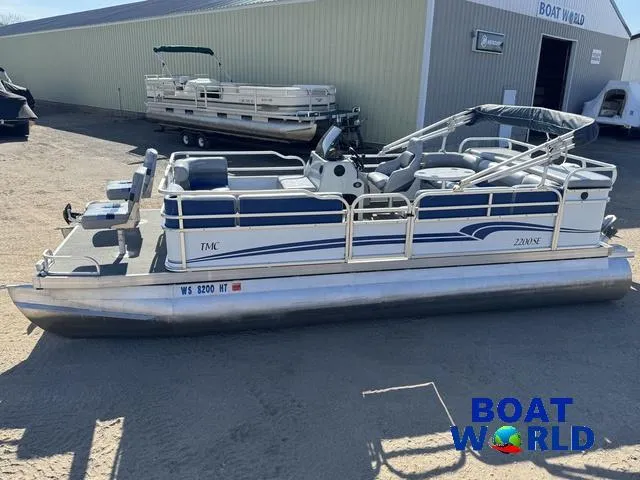 Slide: The Image of 2011 TMC 2200 SE Pontoon boat at Boat World dealership. - 3