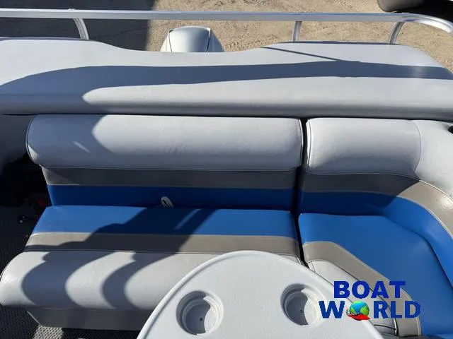 Slide: The Image of TMC 2200 SE Pontoon 2011 interior with blue and gray seating, Boat World logo visible. - 35