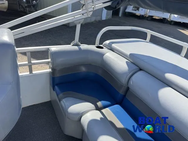 Slide: The Image of 2011 TMC 2200 SE Pontoon boat interior with gray and blue seating. - 36