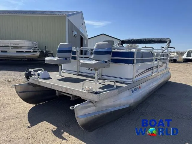 Slide: The Image of 2011 TMC 2200 SE Pontoon boat with dual seats, parked outdoors at Boat World. - 38