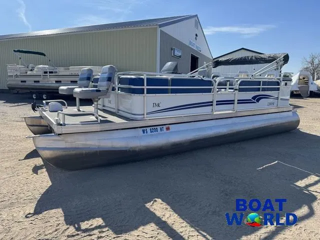 Slide: The Image of 2011 TMC 2200 SE Pontoon boat parked outdoors at Boat World dealership. - 39