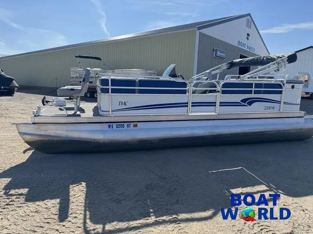 Slide: The Image of 2011 TMC 2200 SE Pontoon boat parked outside Boat World dealership. - 40
